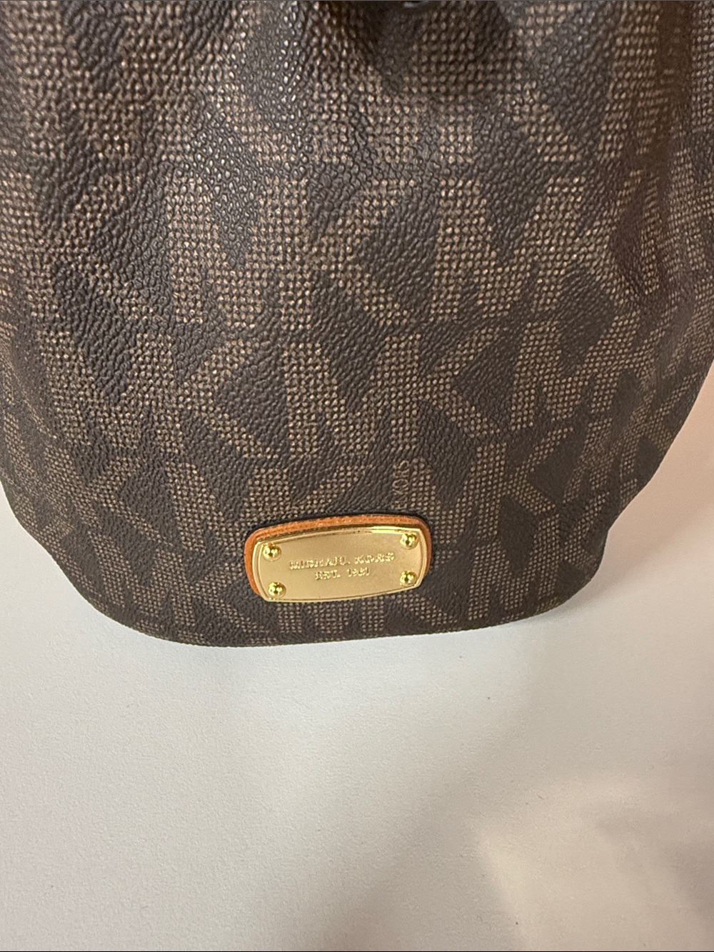 Michael Kors Brown Monogram Bucket Bag with Gold Plaque